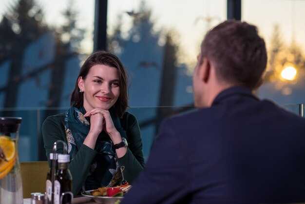 Voice pitch, pace and laughter: vocal signs of growing warmth